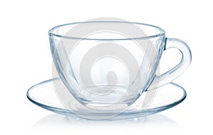 Glass cup and saucer isolated on white