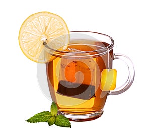 Glass cup of tea with lemon and mint isolated on white