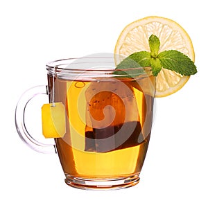 glass cup of tea with lemon and mint isolated on white background