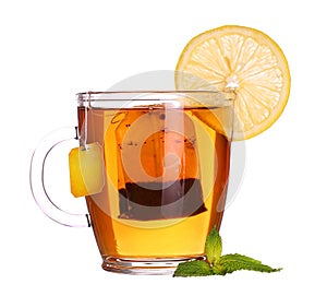 glass cup of tea with lemon and mint isolated on white background