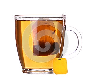 Glass cup of tea with lemon and mint on white