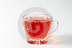 Glass cup with tea on a white background isolated.