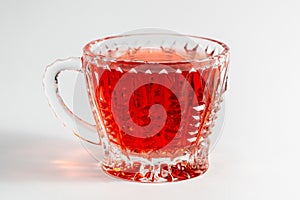 Glass cup with tea on a white background isolated.