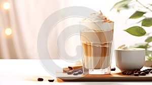 Glass of Dalgona Coffee on table, breakfast atmosphere with homemade coffee drink, bokeh background. Fluffy creamy whipped instant