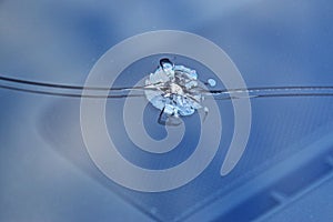 Glass damage from stone chips in the windscreen