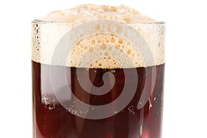Glass dark beer with rich froth