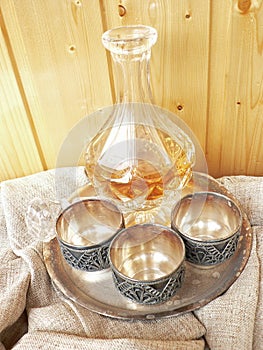 Glass decanter wint three melchior cups photo