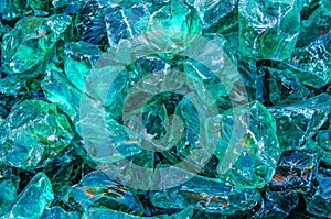 Glass decorative stones, chipped glass for garden decor, landscape design. Shiny stones background