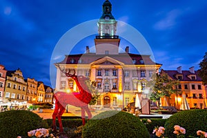 A glass deer as the emblem of the Jelenia Gora city on the Town Hall Square at dusk. Poland