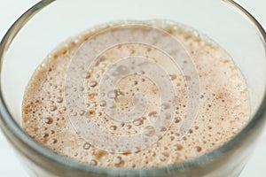 Glass of delicious chocolate milkshake, close up