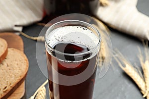 Glass of delicious kvass on table