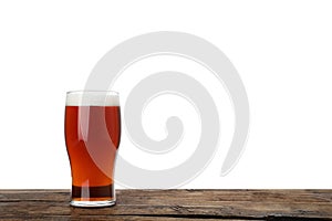Glass of delicious kvass on table, white background