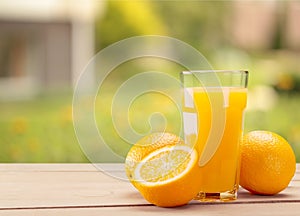 Glass of delicious orange juice on natural