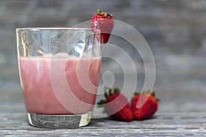 Glass with delicious strawberry milkshake