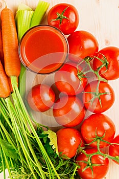 Glass of different vegetable juices with carrots, tomatoes and c