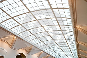 Glass dome or glass roof with white structure in shopping mall