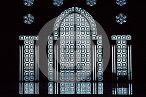 Glass door in the Hassan II mosque in Casablanca Morocco. Built over the sea, it lets the blue light enter through the ornamental