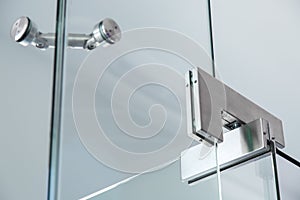 The glass door pivot hinge. photo