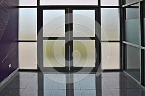 Glass door and wall of building photo