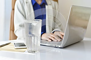 A glass of drinking water on office desk