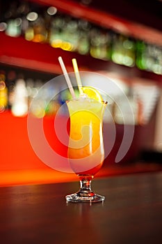 Glass with drinks and alcohol and citrus in bar table 