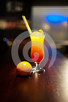 Glass with drinks and alcohol and citrus in bar table 