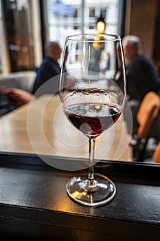 Glass of dry French merlot red wine from Bordeaux, France photo