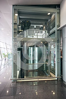 Glass elevator at airport terminal