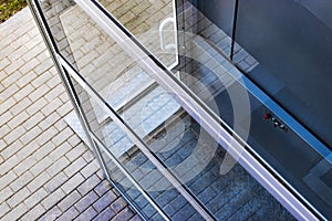 Glass elevator for disabled and disabled people at the entrance to a modern building. Caring for people