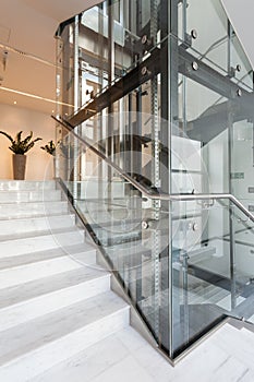 Glass elevator in modern building