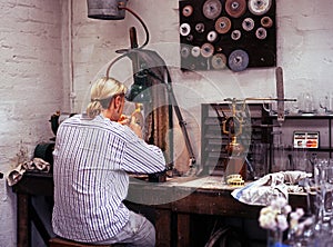 Glass Engraver in workshop.