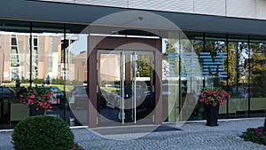 Glass facade of a modern office building with IBM logo. Editorial 3D rendering
