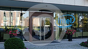 Glass facade of a modern office building with Intel Corporation logo. Editorial 3D rendering