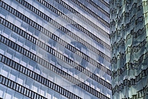 Glass Facade Of Modern Office Buildings With Reflections Of Neighboring Towers In The City Of Vienna