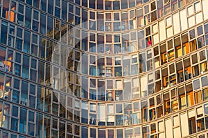 Glass facade of a modern skyscraper hosting luxury apartments