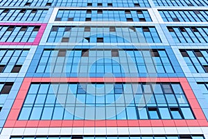 Glass facade of a multi-apartment high-rise residential building