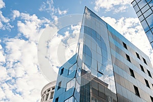 Glass facade texture of a modern office building. High tech architecture. Elements of urban design. Windows of