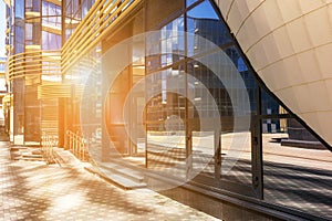 Glass facades of modern architecture on a bright sunny day in the blue sky