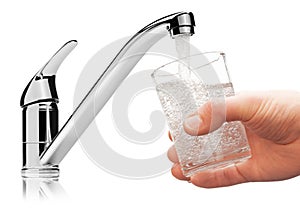 Glass filled with drinking water from tap.