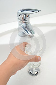 Glass filled with drinking water from tap