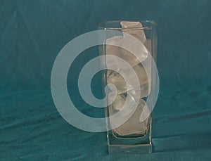 A glass filled with ice blocks