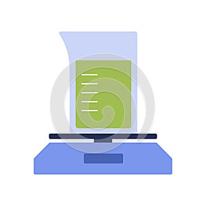 Glass flask with green liquid on electronic scales, chemical laboratory equipment