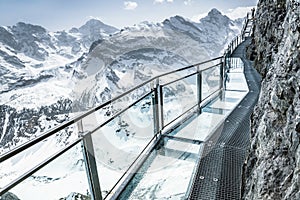 Glass floor on a thrill walk on the top of Birg, Switzerland