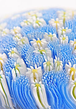 Glass flowers in windy field