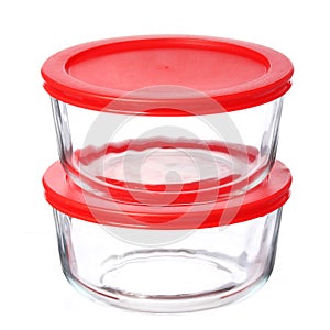 Glass food containers with red plastic lids isolated on white photo