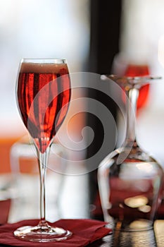 Glass with French alcohol drink Kir Royal