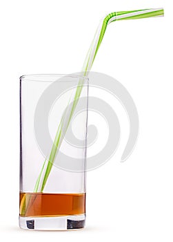 Glass of fresh apple juice with straw green striped. left on the