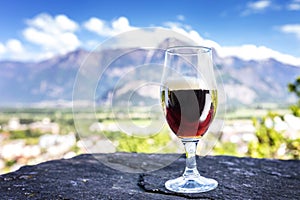 A glass of fresh beer on the background of the mountains