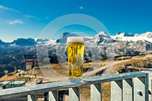 A glass of fresh beer on mountains