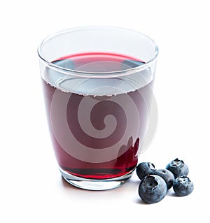 Glass of fresh blueberry juice with blueberries